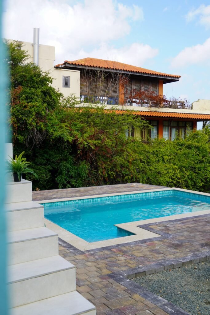 Shared pool with a neighboring villa behind